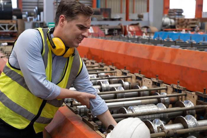 Incident involving a machine worker sustaining a hand injury